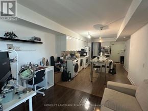 Toronto (Bayview Village) condo for rent - A well-lit, spacious kitchen and living room with a washer and dryer built in.