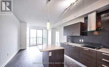 Toronto (Lansing-Westgate) condo for rent - A modern kitchen with dark wood cabinets and a tiled backsplash.