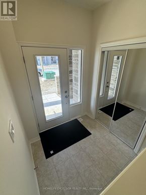 Newmarket (Woodland Hill) townhouse for rent - A room with a glass door leading outside.