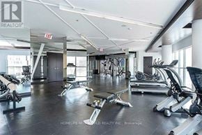 Toronto (Waterfront Communities) condo for rent - A gym with a variety of equipment including treadmills, weights, and exercise machines.