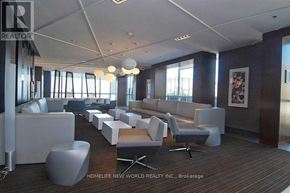 Toronto (Waterfront Communities) condo for rent - A modern living room with a grey sofa set and a wooden floor.