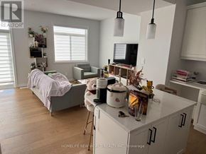 Belleville (Thurlow Ward) townhouse for rent - A wooden deck in front of a house.