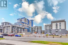 Hamilton (Waterdown) condo for rent - A construction site with a large building under construction and a sign that reads "REALTOR".