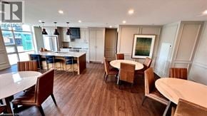Hamilton condo for rent - A well-lit room with a dining table and chairs.