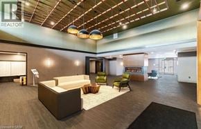 Hamilton condo for rent - A modern office lobby with a reception desk and comfortable seating areas.