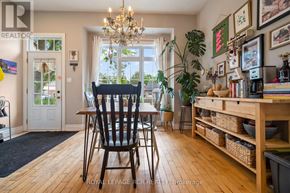 Orangeville apartment for rent - A dining room with a wooden table and chairs.