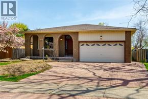 Milton apartment for rent - A house with a brown garage door and a white garage door.