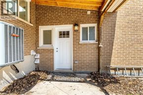 Milton apartment for rent - A white door is on the front of a brick house.
