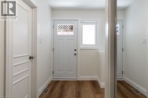 Milton apartment for rent - A white door with a window above it in a hallway.