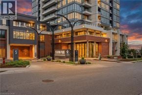 Kitchener condo for rent - A building with a sign that says REALTOR in front of it.