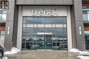 Hamilton (Waterdown) condo for rent - A storefront with the word "trend" on it.