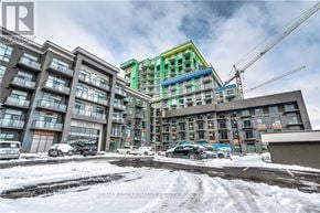 Hamilton (Waterdown) condo for rent - A large building with a green and blue section in the middle.