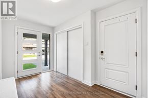 Ottawa townhouse for rent - A white door with a glass window is open to a balcony.
