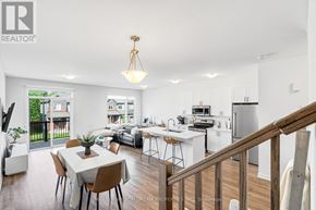 Ottawa townhouse for rent - A well-lit, spacious kitchen and dining area with a view of the outdoors.