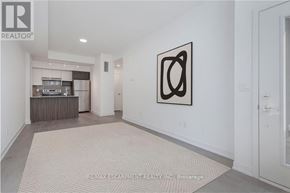 Burlington (Lasalle) townhouse for rent - A modern living room with a large abstract painting on the wall.