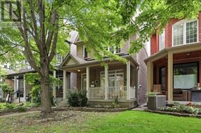 Toronto (The Beaches) apartment for rent - A tree in front of a house with a porch.