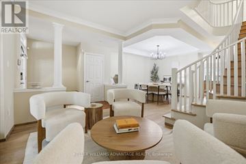 Toronto (The Beaches) apartment for rent - A living room with a white couch and a wooden coffee table.