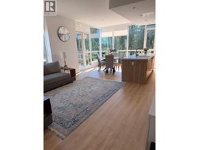 North Vancouver apartment for rent - A living room with a grey couch and a rug in the middle.