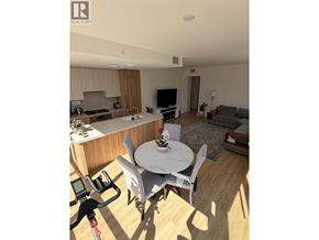 North Vancouver apartment for rent - A well-lit living room with a dining table and chairs.