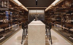 Toronto (Annex) condo for rent - A bar with a white counter and black stools is surrounded by shelves of wine bottles.