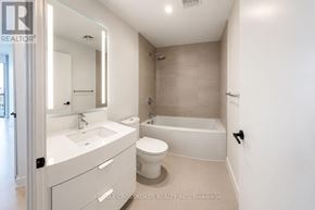 Toronto (Church-Yonge Corridor) condo for rent - A white bathroom with a sink, toilet, and bathtub.