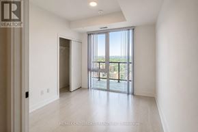 Toronto (Church-Yonge Corridor) condo for rent - A spacious room with a sliding glass door leading to a balcony.
