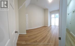 Toronto (University) apartment for rent - A room with wooden flooring and white walls.