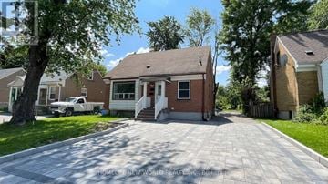 Richmond Hill (Crosby) apartment for rent - A brick house with a driveway in front of it.