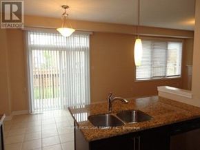 Markham (Greensborough) apartment for rent - A kitchen with granite countertops and a sink.