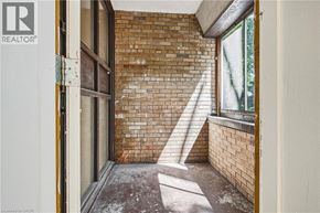 Hamilton apartment for rent - A room with a brick wall and a window.