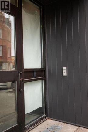 Stratford multi-family for rent - A door with a glass window and a handle.