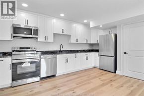 Windsor apartment for rent - A kitchen with white cabinets and stainless steel appliances.