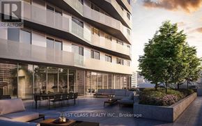 Toronto (Church-Yonge Corridor) condo for rent - A modern building with a balcony and a tree in front of it.