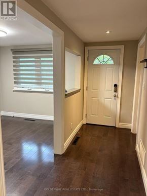 Newmarket (Gorham-College Manor) apartment for rent - A hallway with a white door and a window with blinds.