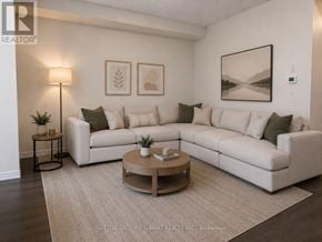 Caledon townhouse for rent - A living room with a white couch and a coffee table.