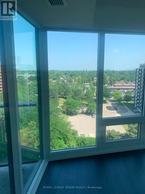 Toronto (Humber Heights) condo for rent - A view from a window looking out at a residential area.