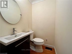 St. Catharines (Bunting/Linwell) apartment for rent - A white sink and toilet in a small bathroom.