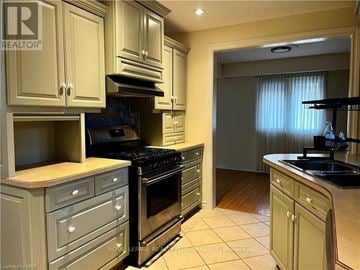 St. Catharines (Bunting/Linwell) apartment for rent - A kitchen with a stove top oven and a sink.