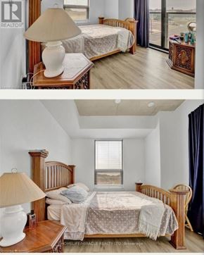 Brantford condo for rent - A bedroom with a bed, nightstand, and lamp.