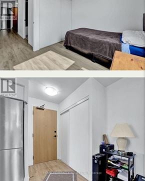 Brantford condo for rent - A bedroom with a bed, a fridge, and a door.