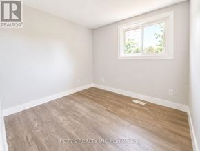 London East (East I) apartment for rent - A room with a window and wooden flooring.