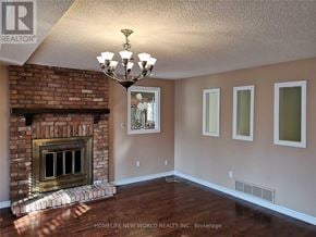 Markham (Unionville) apartment for rent - A room with a fireplace and a chandelier.