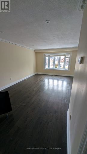 Brampton (Madoc) apartment for rent - A room with wooden floors and a window.