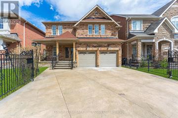 Brampton (Vales Of Castlemore) apartment for rent - A large, well-maintained house with a driveway in front.