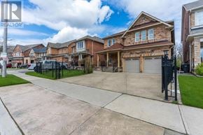 Brampton (Vales Of Castlemore) apartment for rent - A real estate sign is displayed in front of a house.