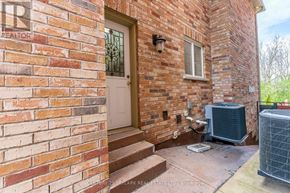 Brampton (Vales Of Castlemore) apartment for rent - A brick house with a white door and a window.