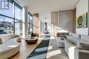 Mississauga (Cooksville) condo for rent - A modern living room with white furniture and a large window.