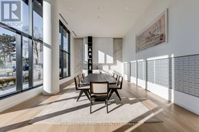 Mississauga (Cooksville) condo for rent - A modern dining room with a long table and chairs.