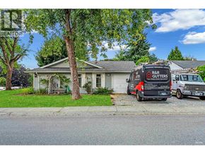 Maple Ridge apartment for rent - A house with a tree in front and a truck parked in front of it.