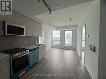 Oakville (Jm Joshua Meadows) condo for rent - A modern kitchen with a stove top oven and a microwave.